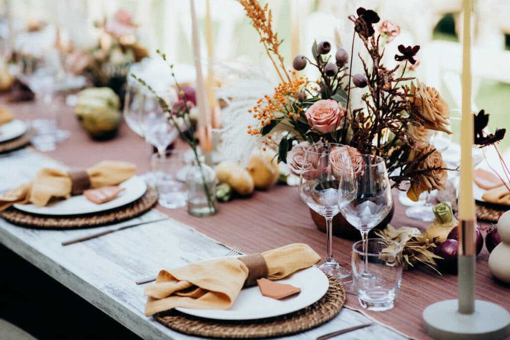 Beautiful wedding table decoration and setting in rustic / village style. Italian wedding.