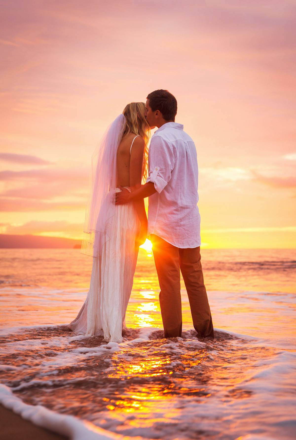Bride and Groom, Enjoying Amazing Sunset on a Beautiful Tropical Beach, Romantic Married Couple Kissing