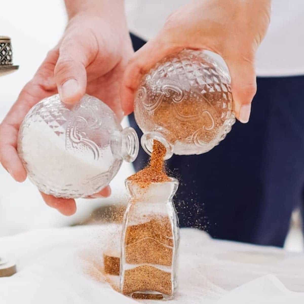 couple pouring sand