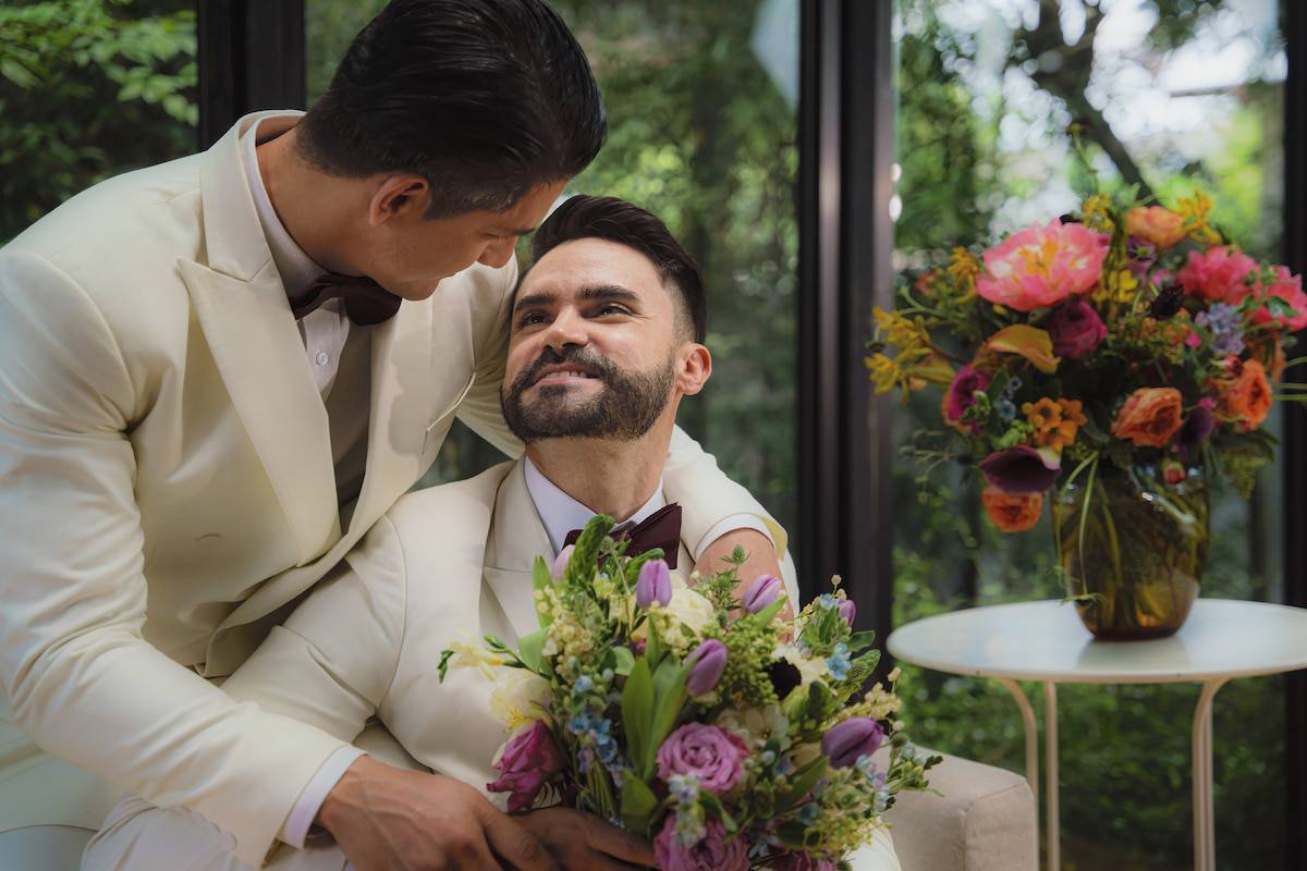 caucasian lgbtq gay marriage couple having romantic moment together after wedding ceremony. Concept of LGBTQ same sex relation