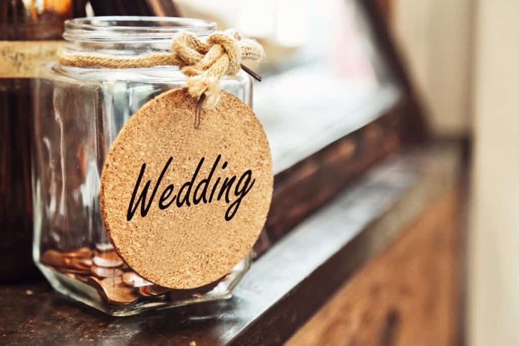 Wedding money jar on table.