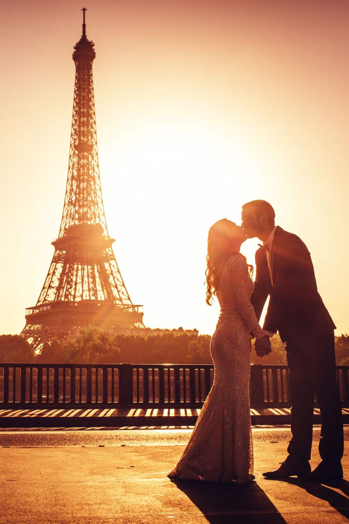 couple by Eiffel tower.